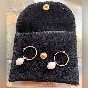 Gabrielle Sanchez freshwater pearl earrings on 14K gold endless hoops.